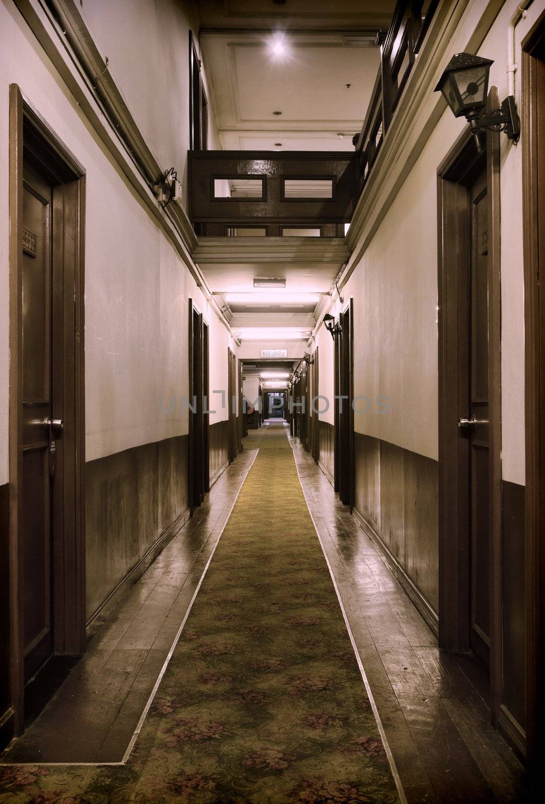 hallway with rooms inside a rough old hotel