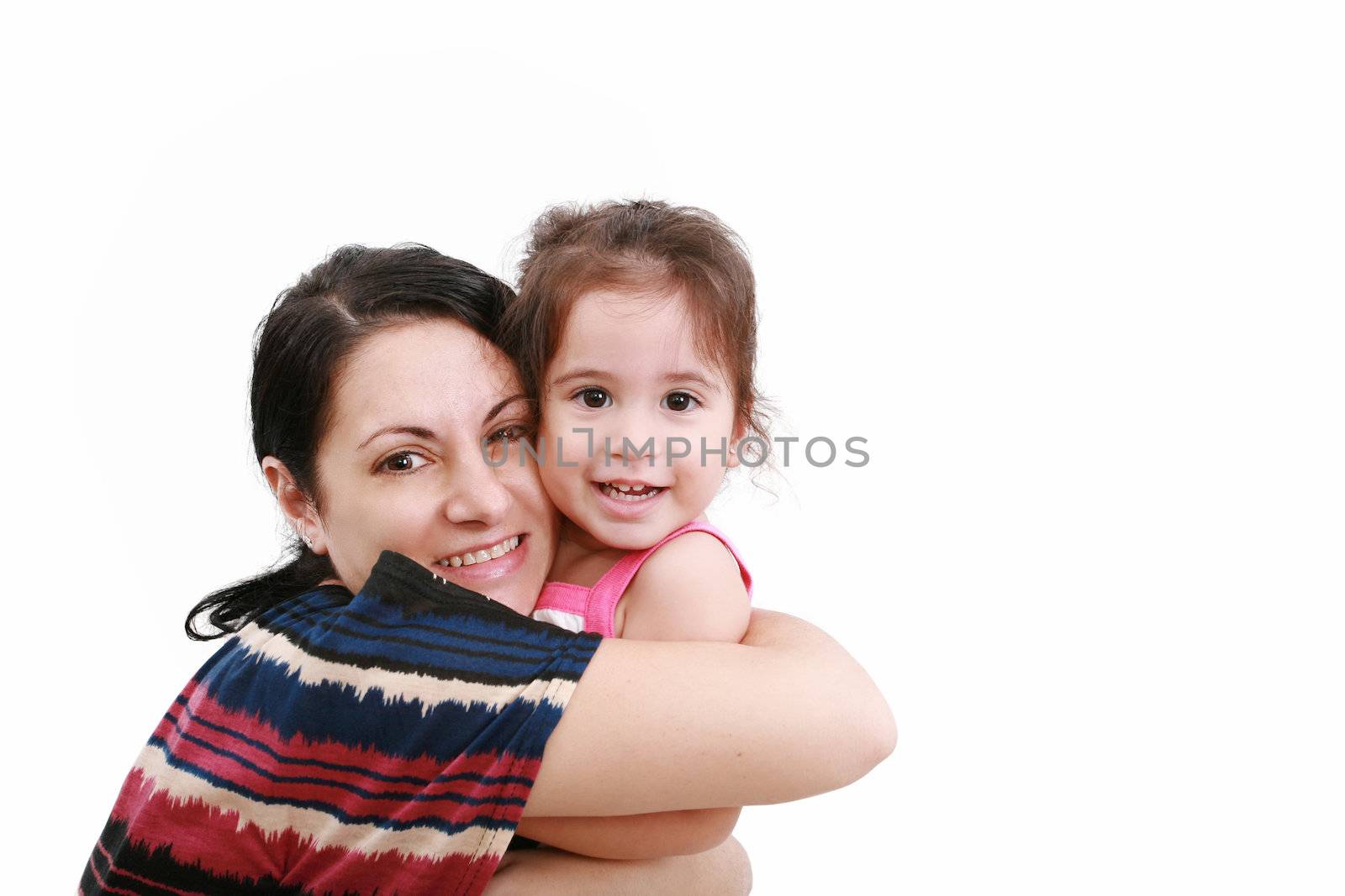 beautiful young mother and her two year old daughter looking at camera