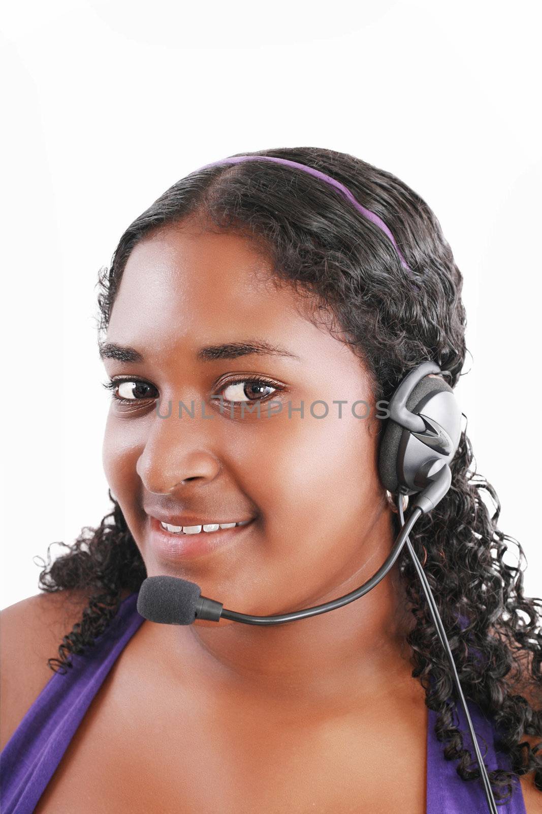 Smiling black customer service and support woman wearing headset by dacasdo