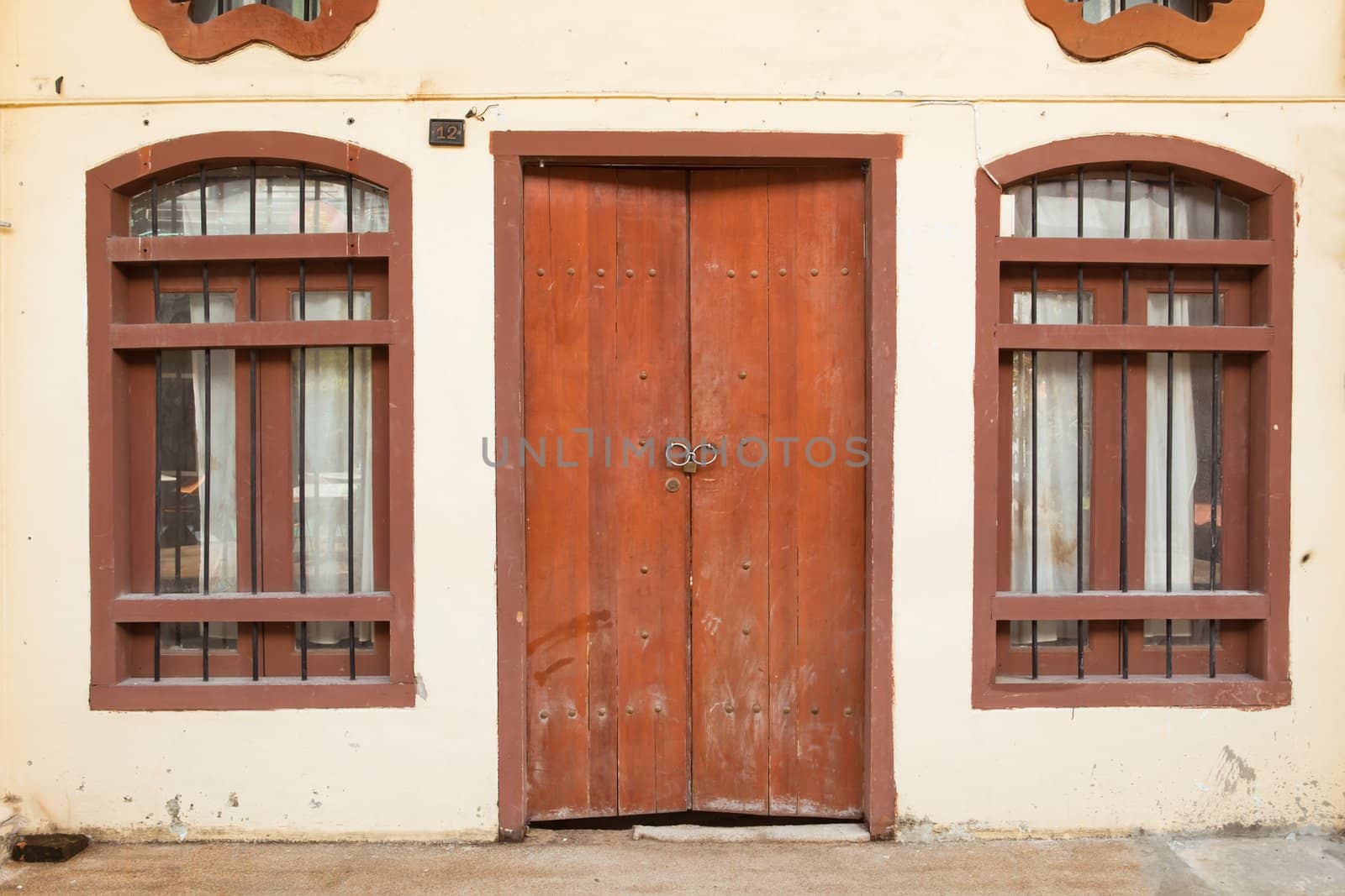 old wood door and window on wall of house