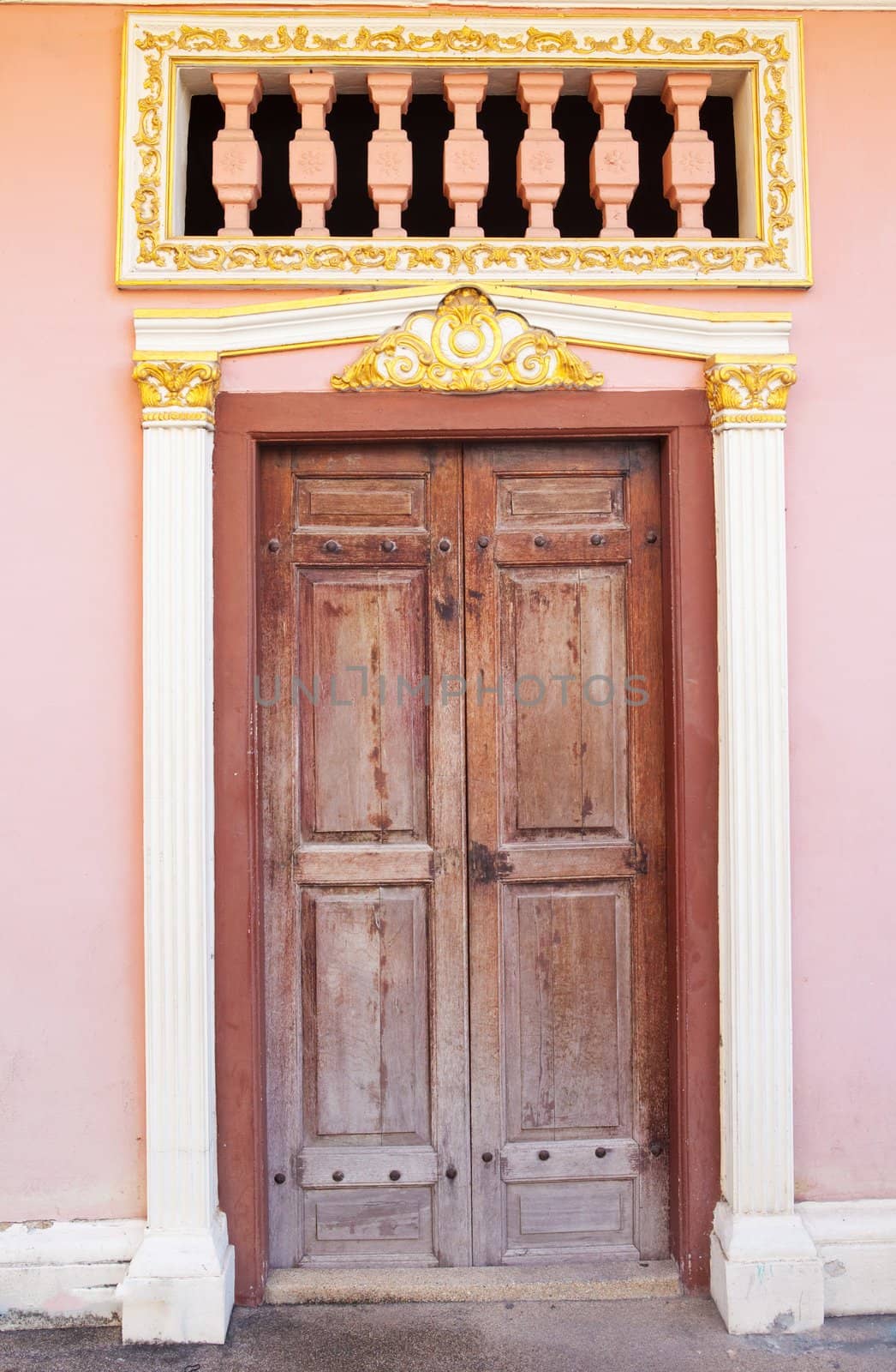 old wood door on wall of house