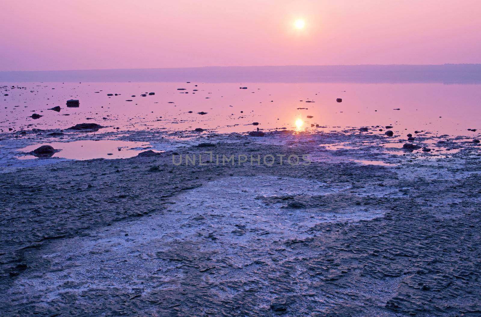 Dried-up salt lake at sunset at Kuyalnik lake