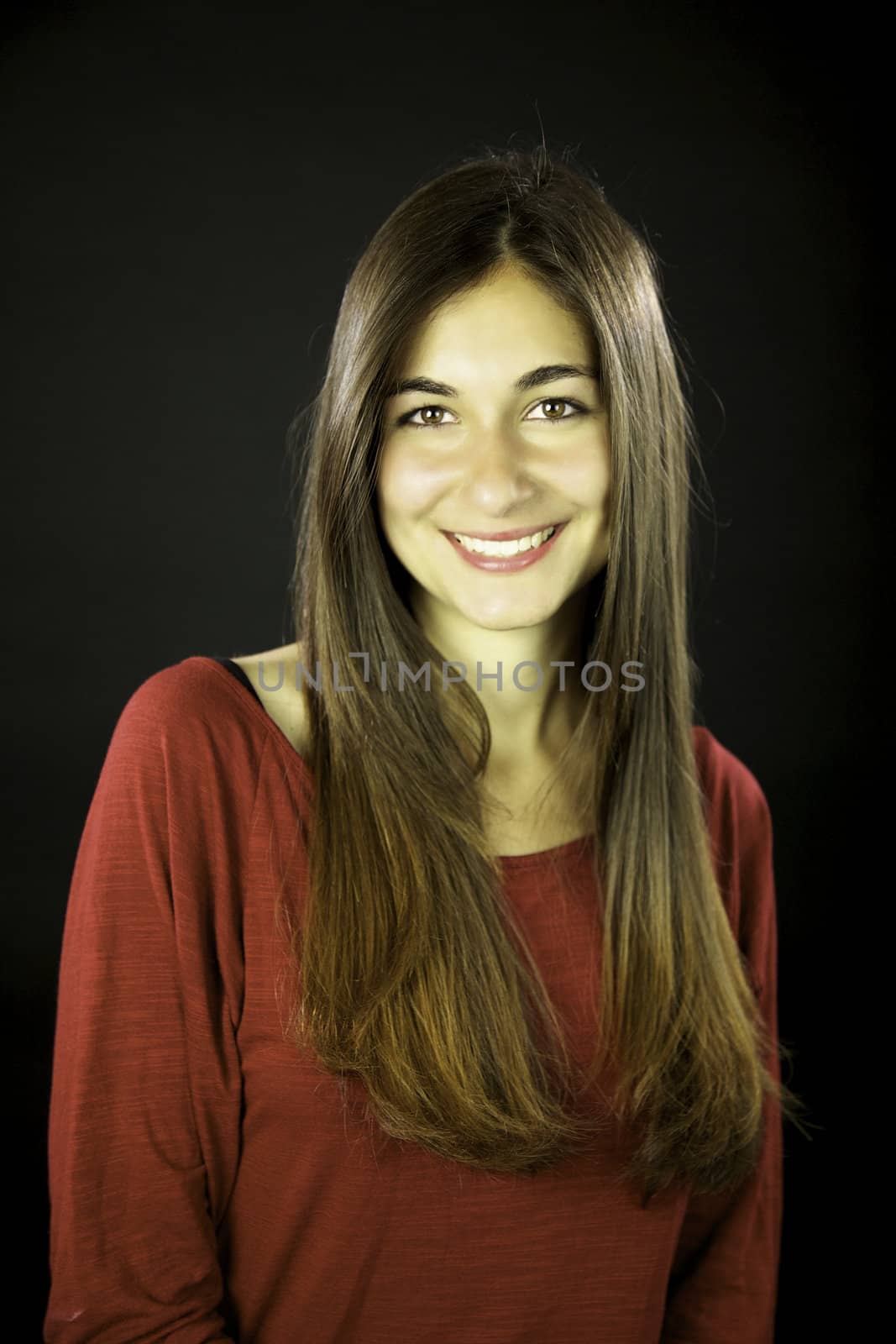 Young woman with gorgeous smile and beautiful long straight hair
