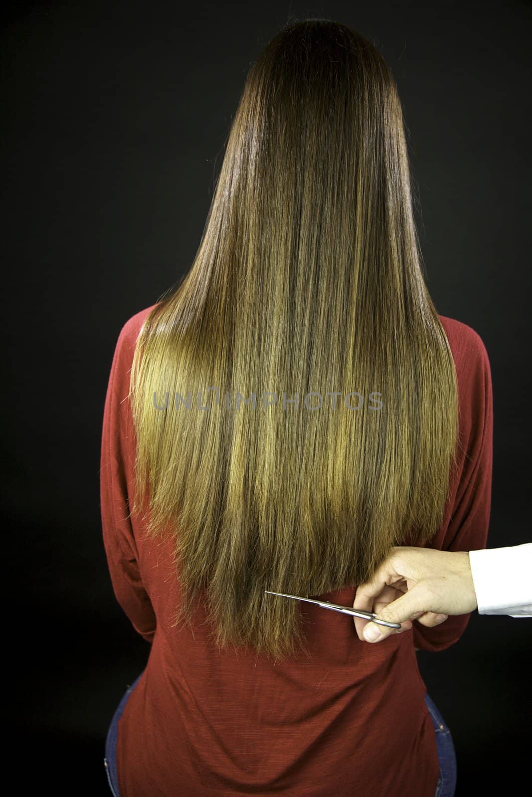 Hairdresser cuts long ruined hair by fmarsicano