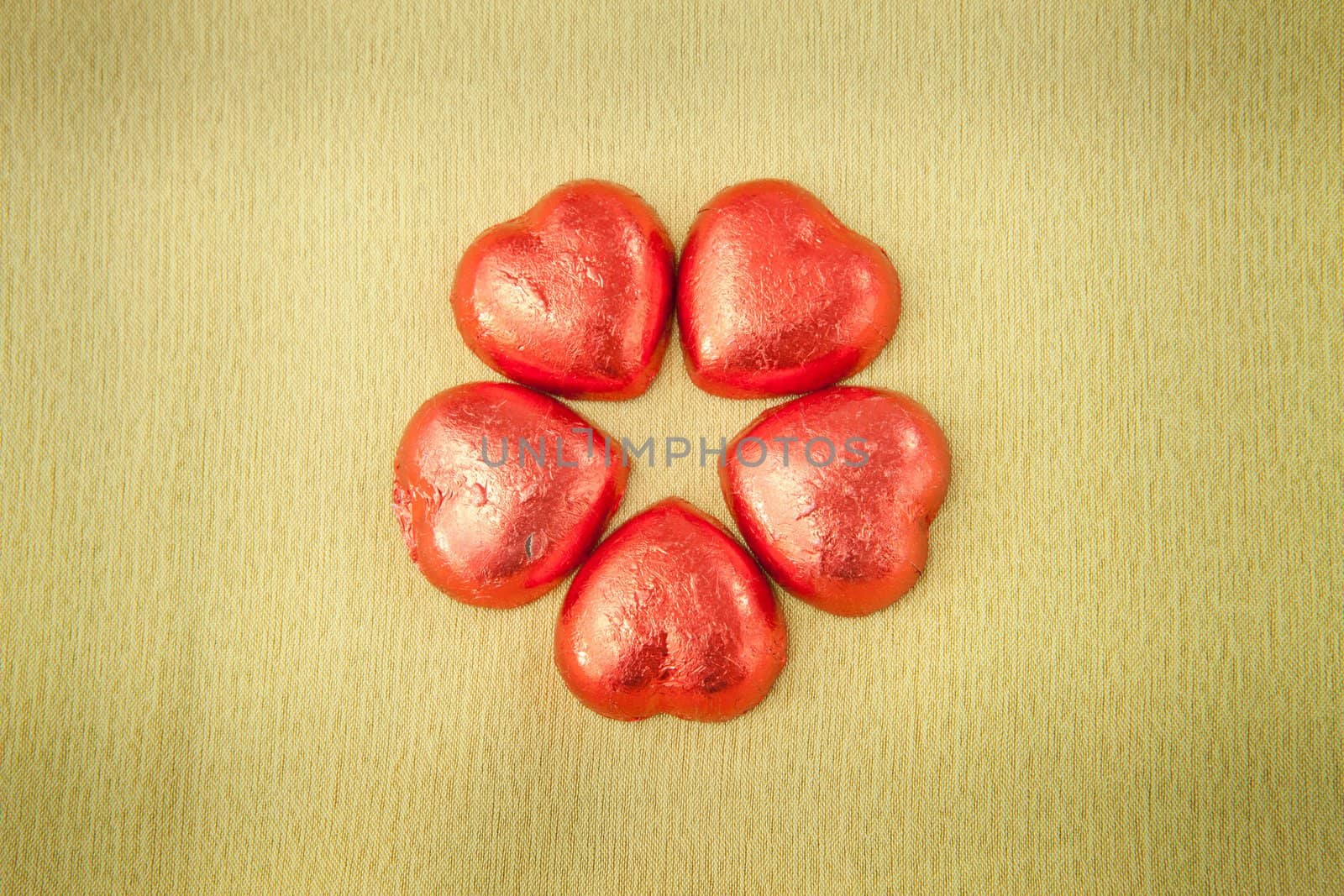 Chocolate heart shaped cookies on brown background