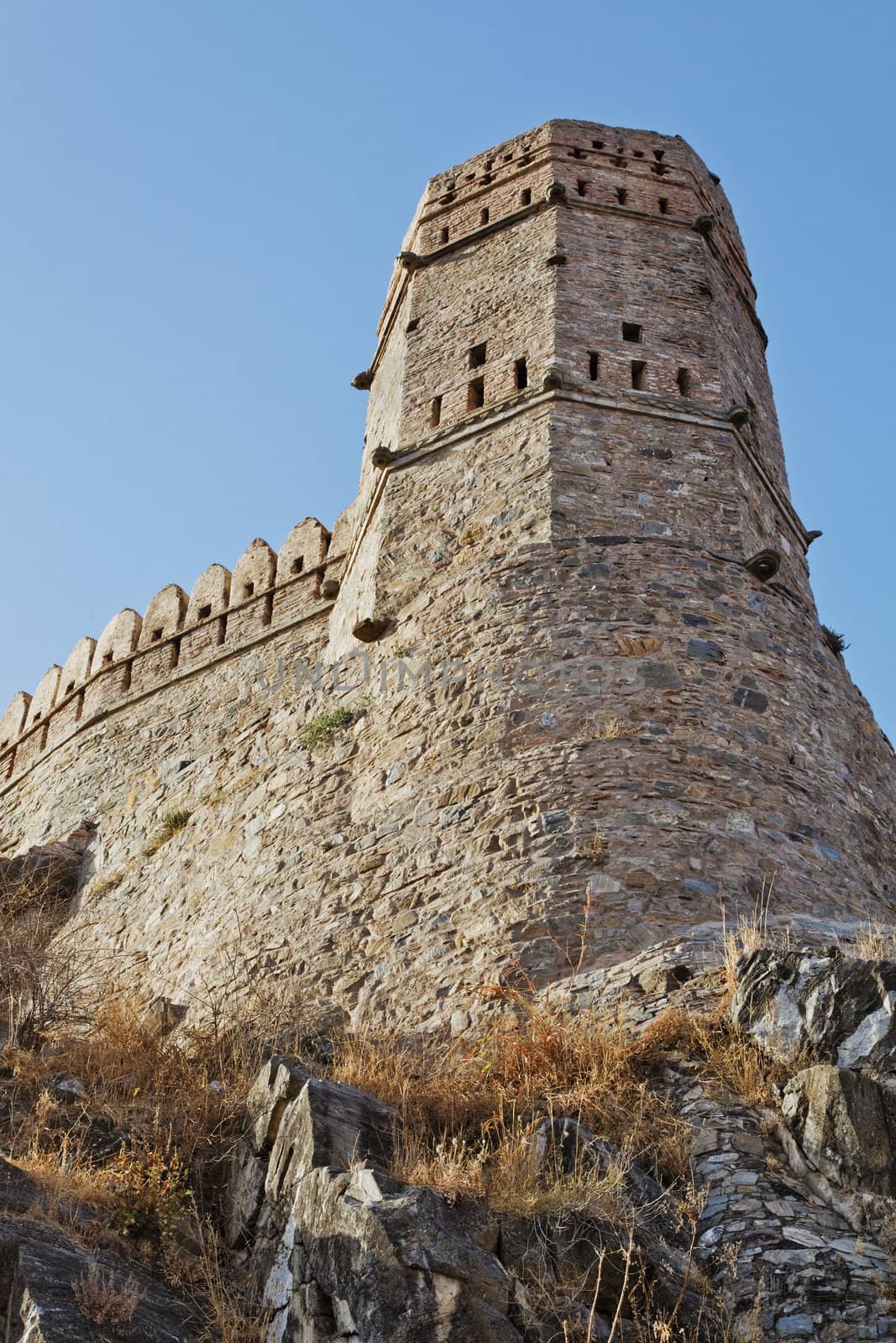 vertical portrait of a watch tower Kumbhalghar Fort Rajasthan India showing nineth century architecture