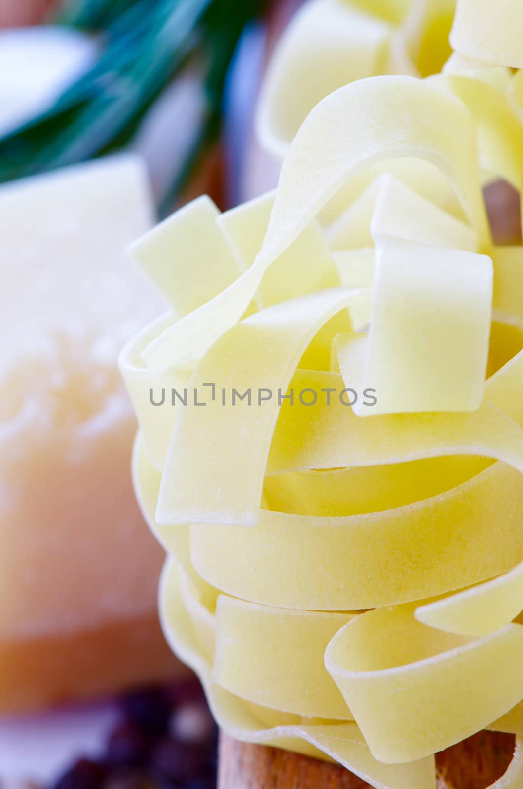 Uncooced pasta parmesan pepper composition close up