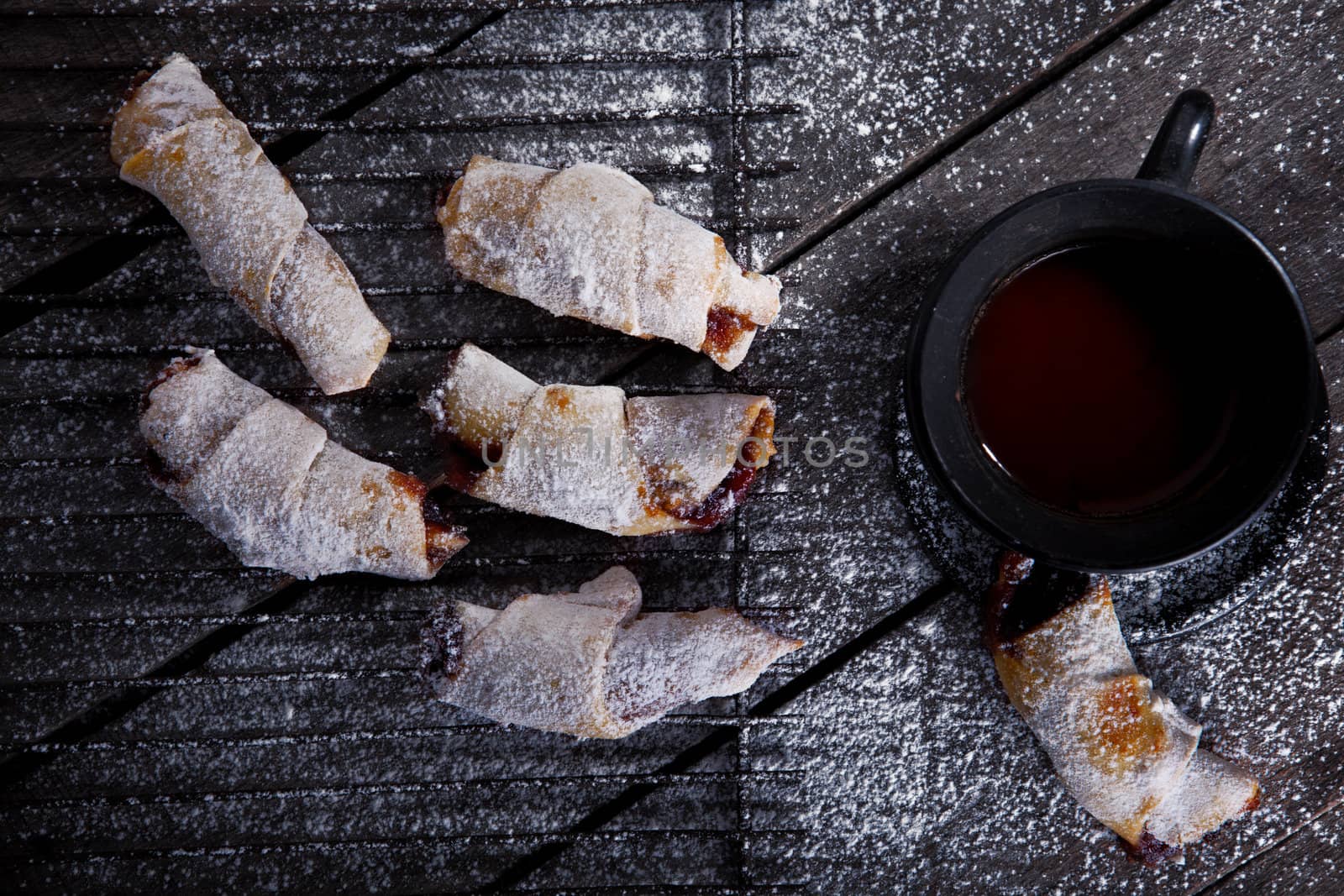 Sweet cookies with coffee on the wooden table