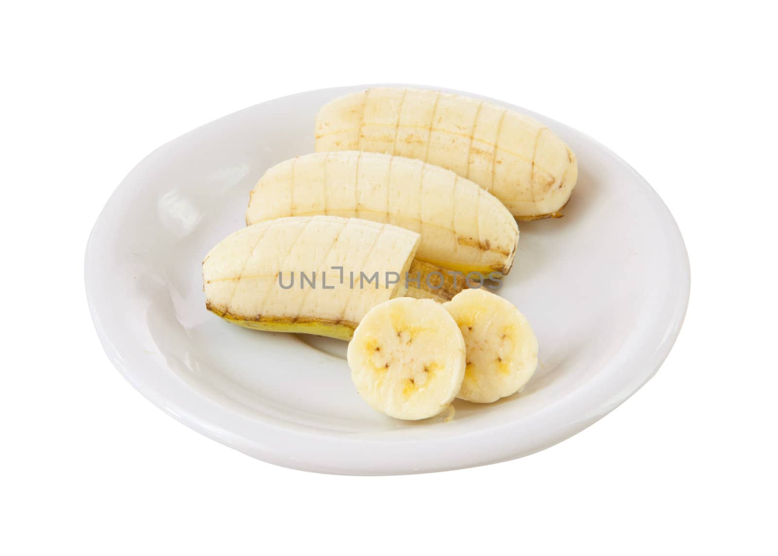 banana on dish isolated on white background