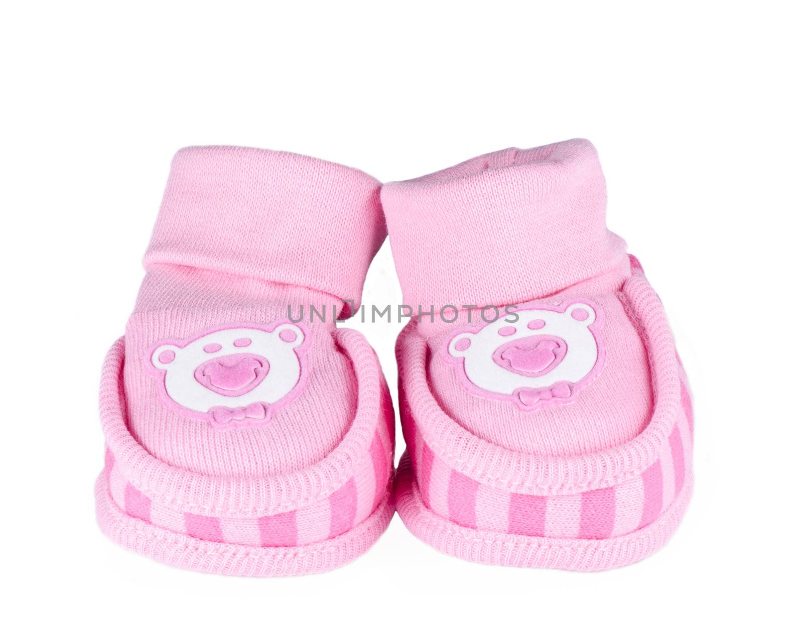 Pink baby shoes isolated