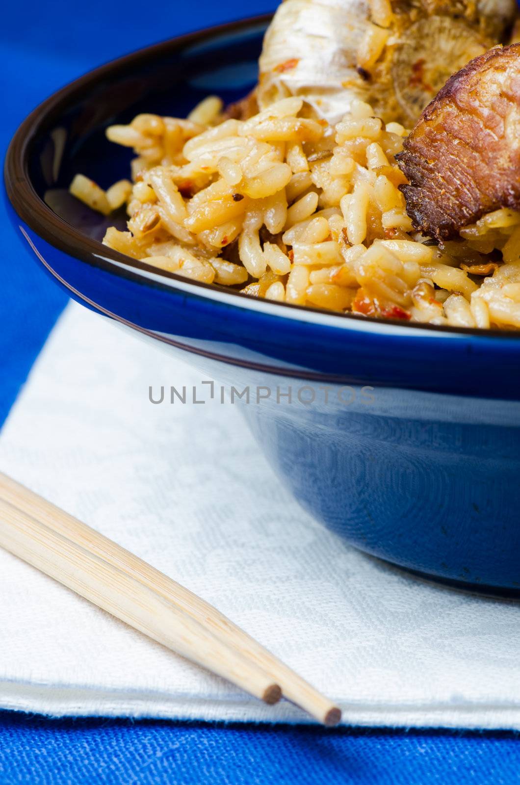 Rice with meat in blue bowl