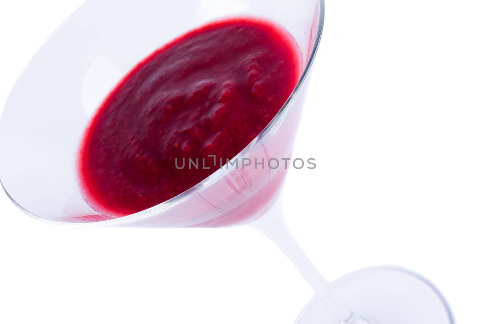 Martini glass with red drink close up