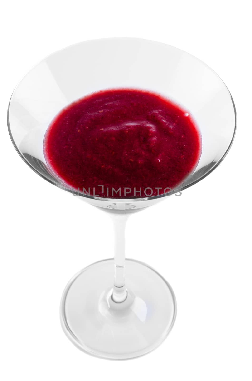 Martini glass with red drink isolated