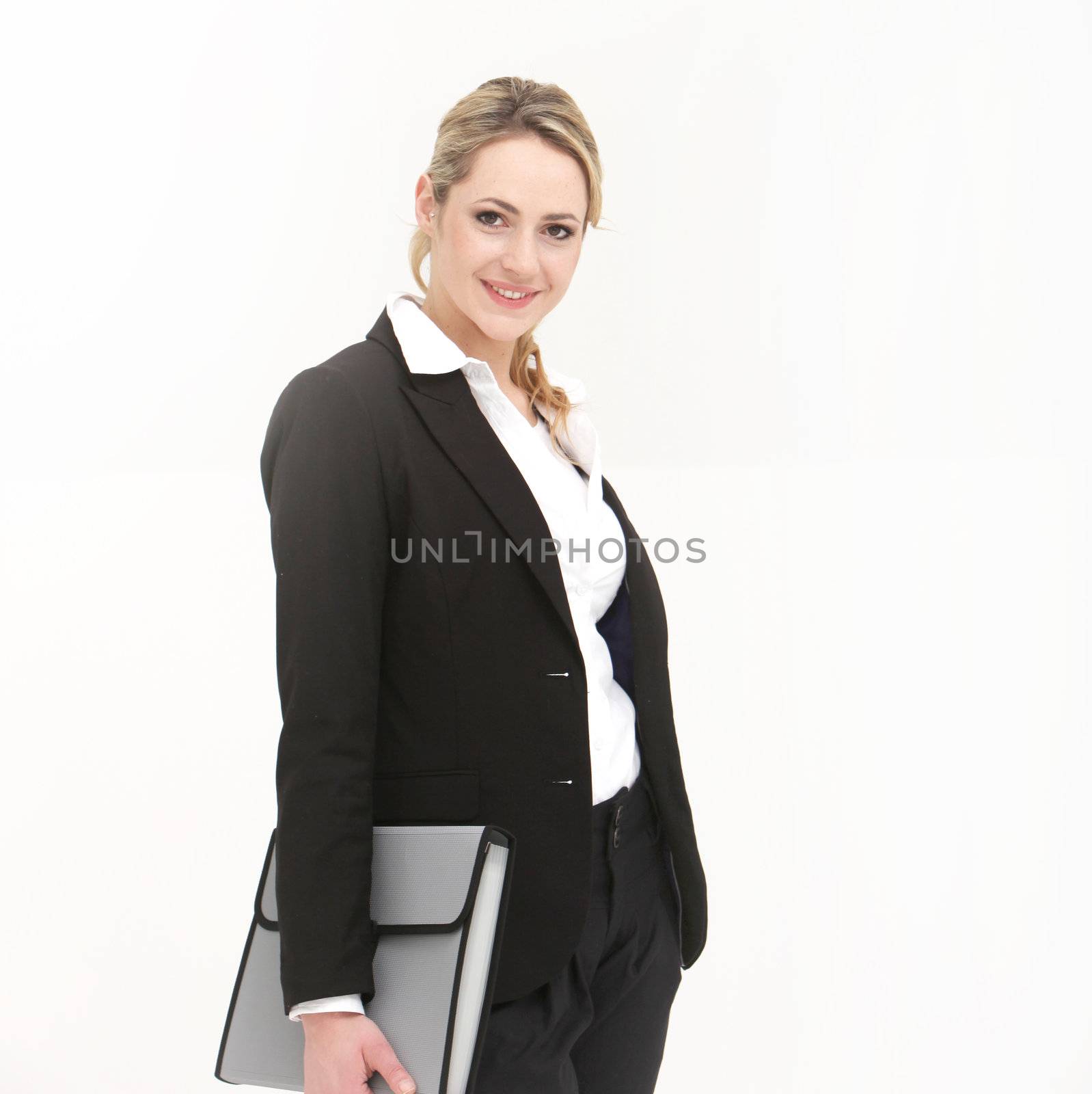 Attractive, smiling business woman in black suit on white background