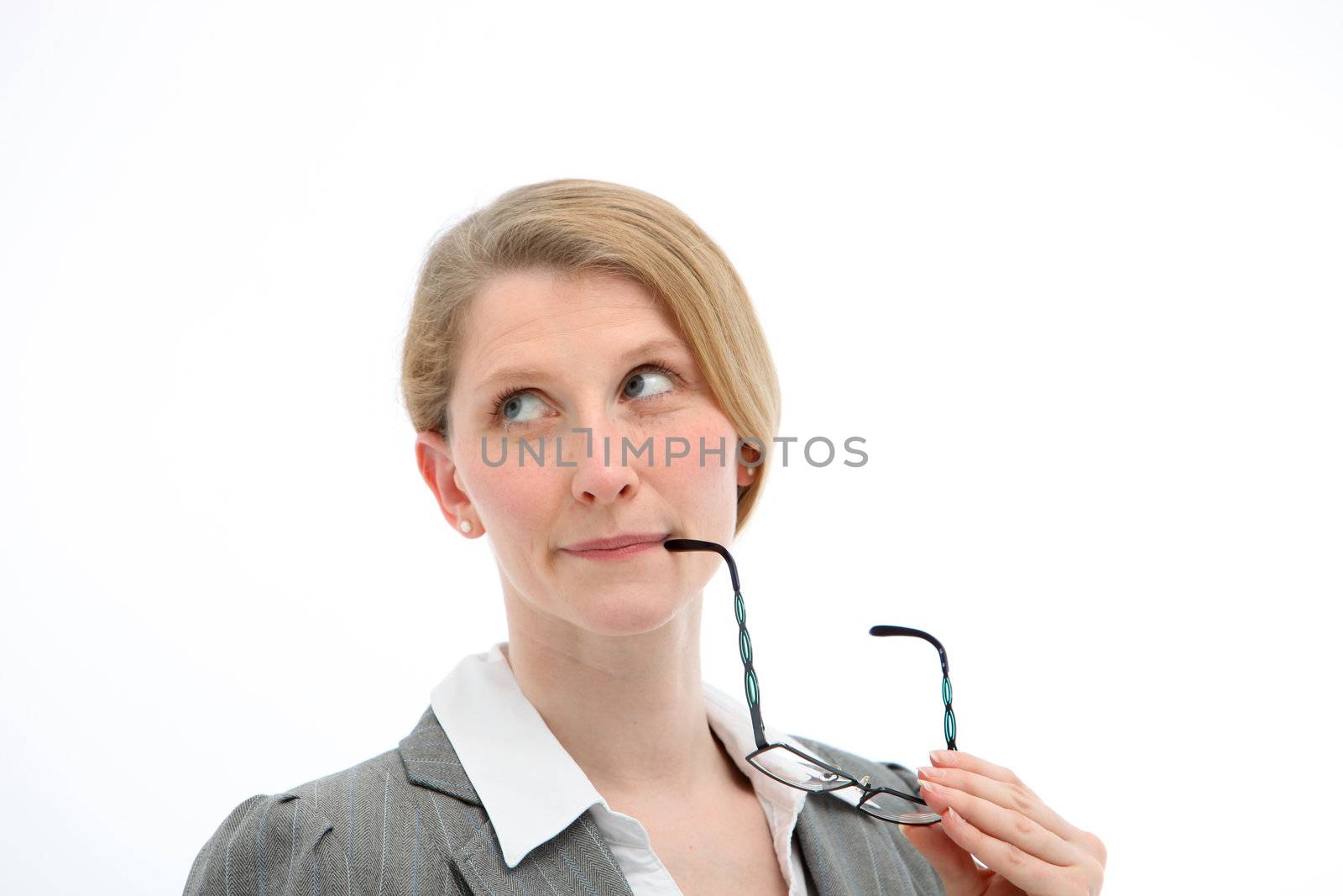 Sceptical woman holding glasses to her mouth looking heavenwards for inspiration and enlightenment