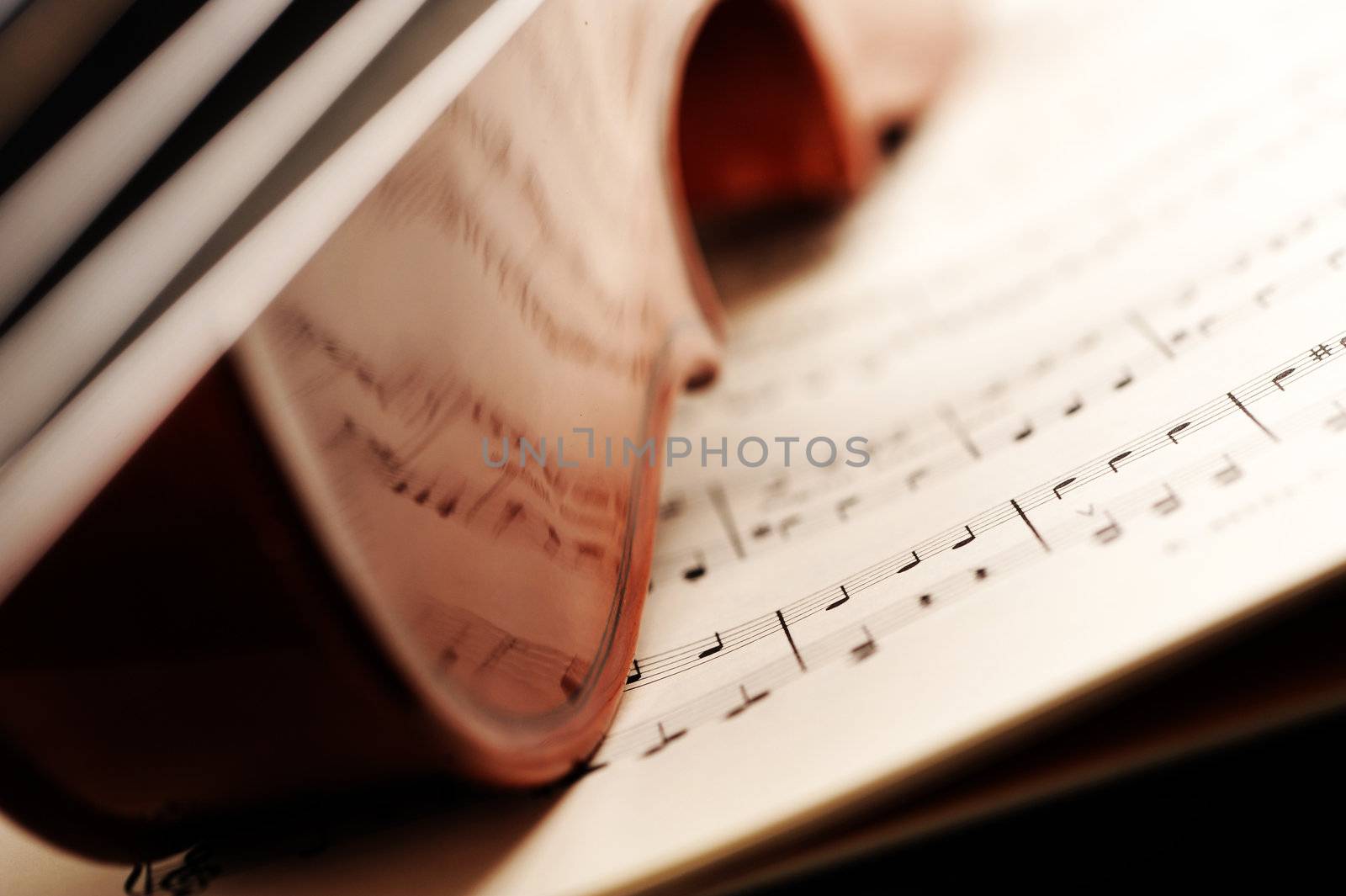  violin on a music sheet, shallow deep of field