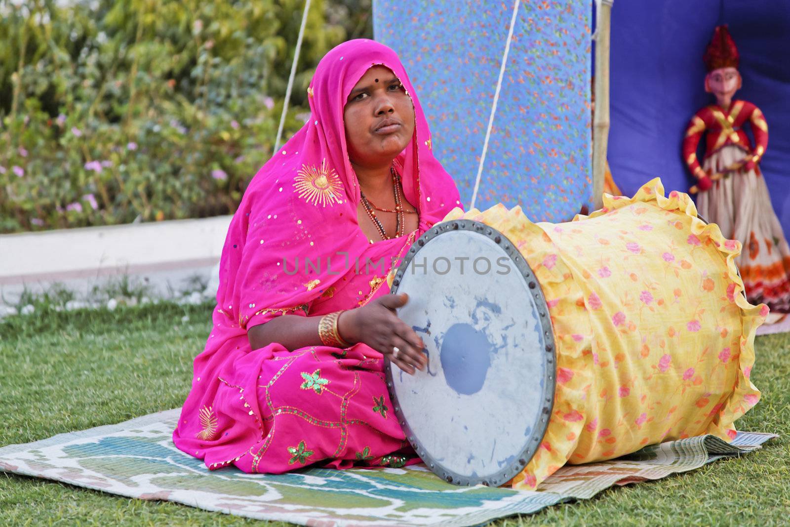 Indian lady performer of folk lore stories as part of a husband and wife team in Rajasthan India