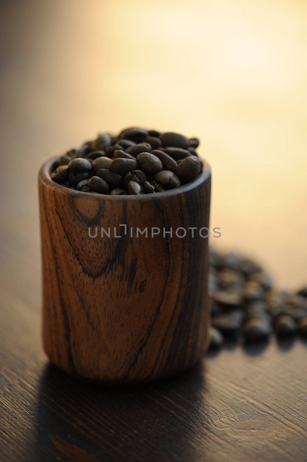 wooden cup with coffee beans