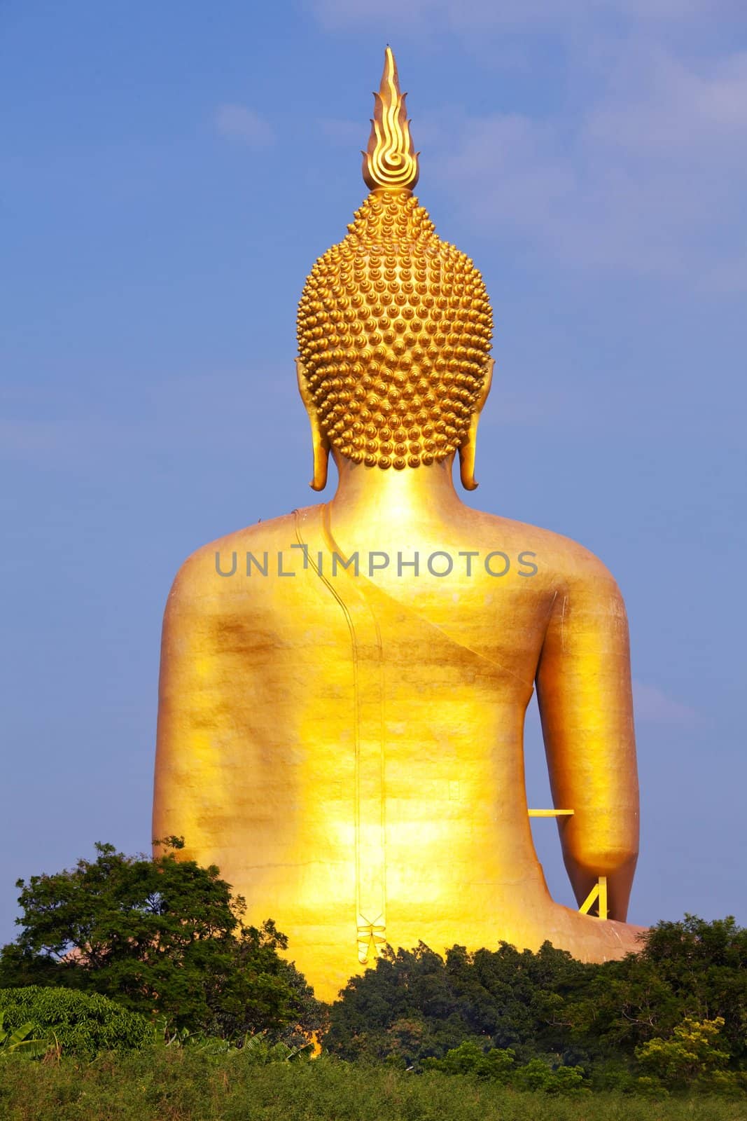 Big Image Buddha behind statue in thailand.