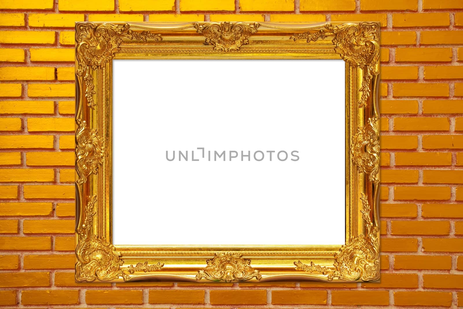 gold frame on brickwall