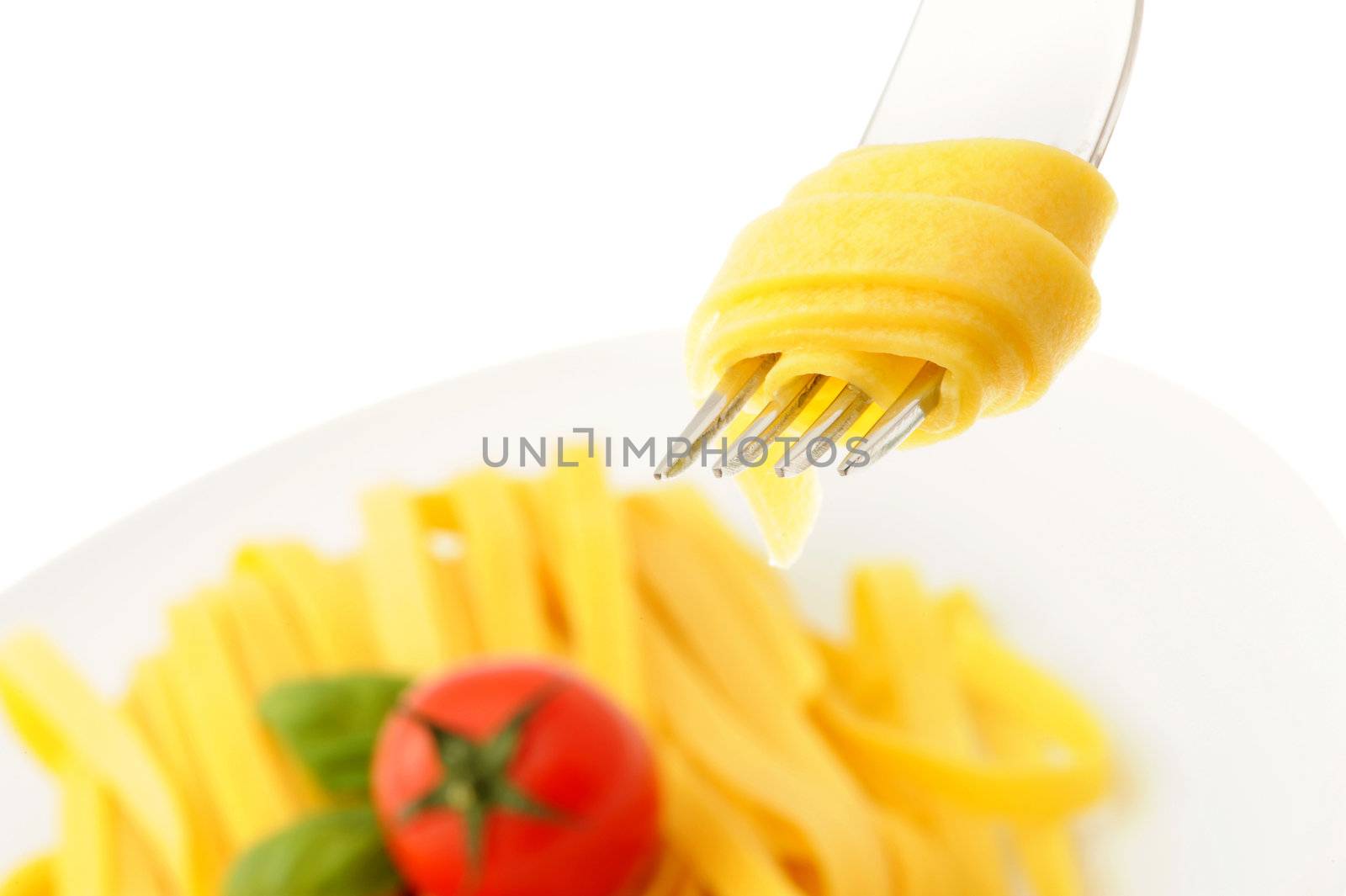 Rolled spaghetti on a fork, italian food