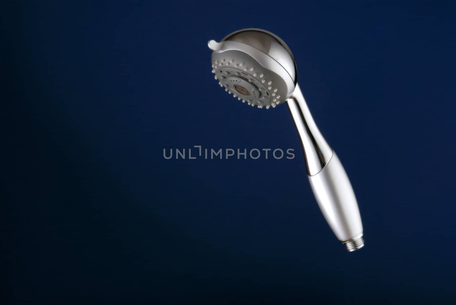 Shower head close-up, on blue background