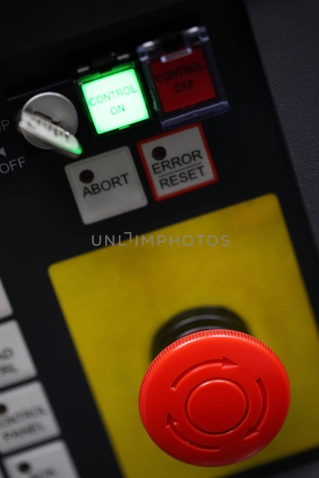 Red stop button in an  machine control panel 
