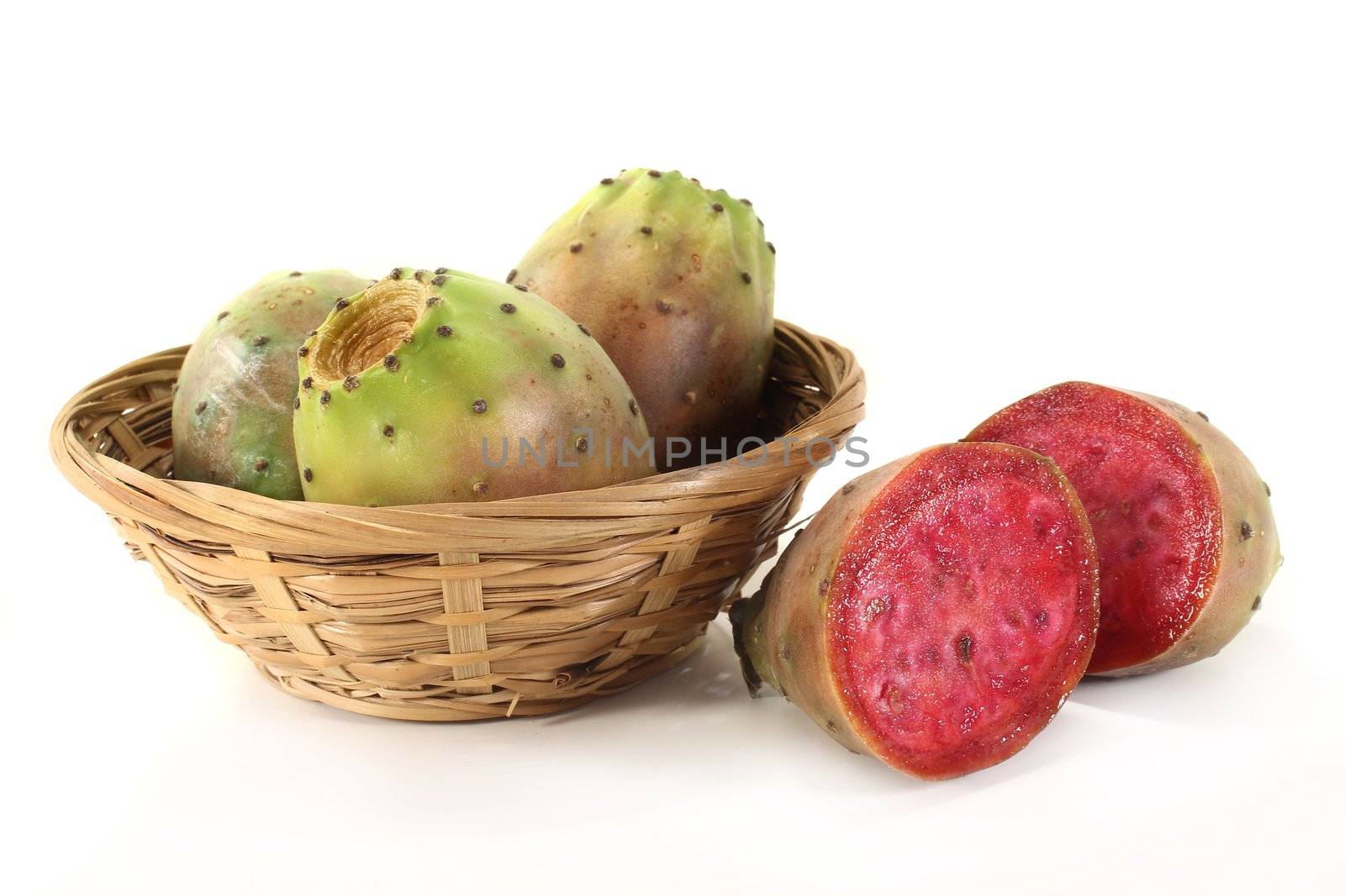 Prickly pears in a basket in front of white background