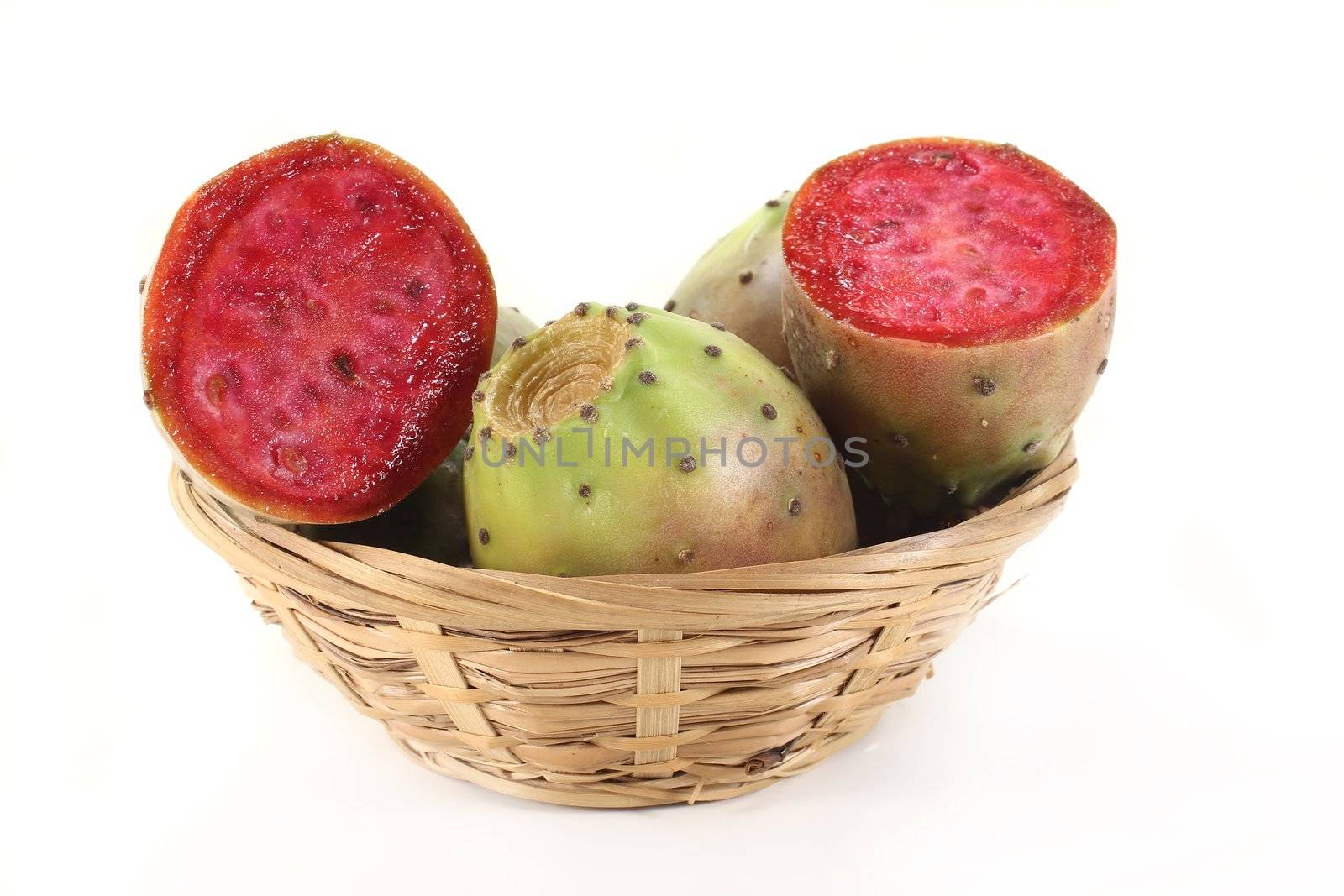 Prickly pears in a basket in front of white background