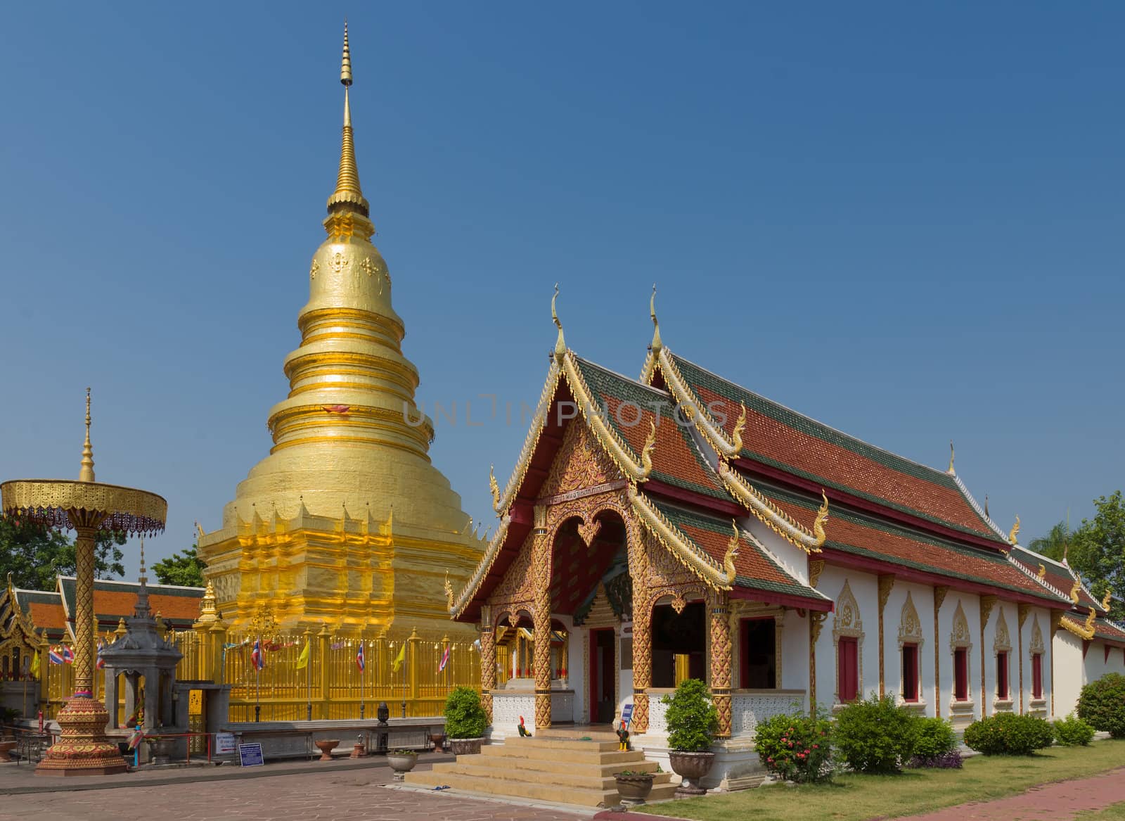 The 46-metre tall golden Chedi which is a major place of worship, Phra That Hariphunchai Woramahawihan Temple, Lamphun, Thailand