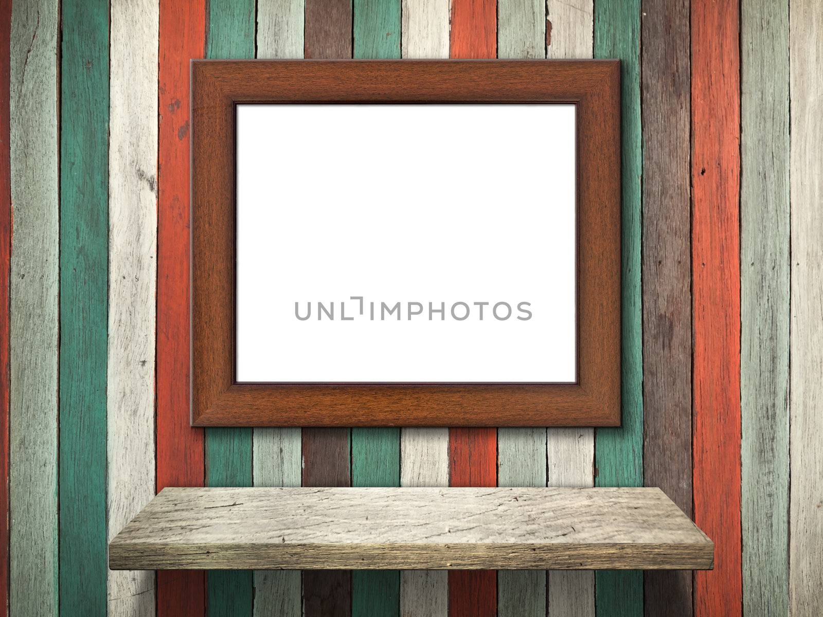 Picture frame on Old wood wall and shelf by nuttakit