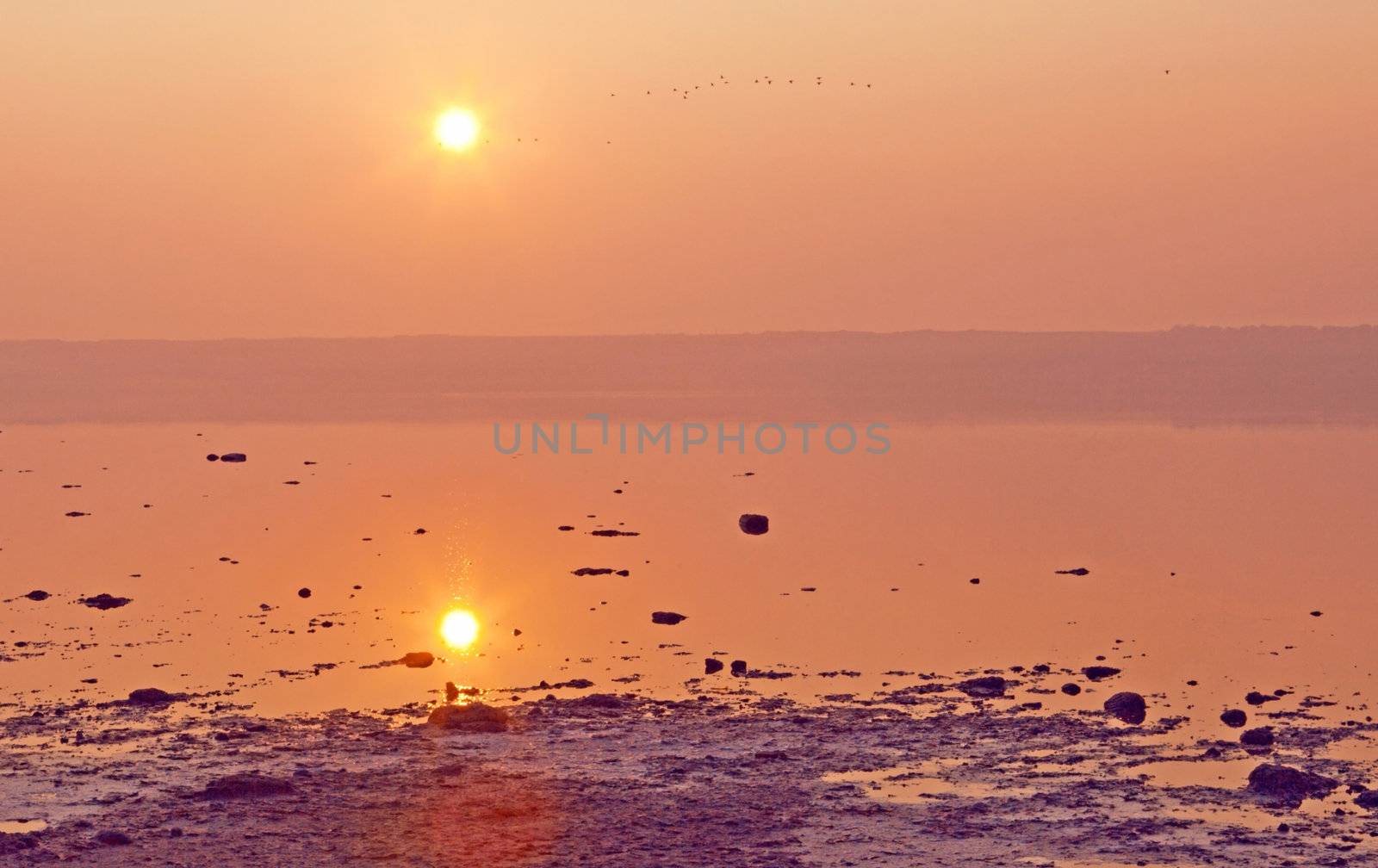 Dried-up salt lake at sunset at Kuyalnik lake