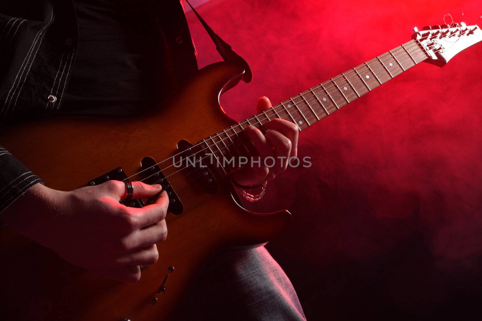 rock guitarist playing at a live concert