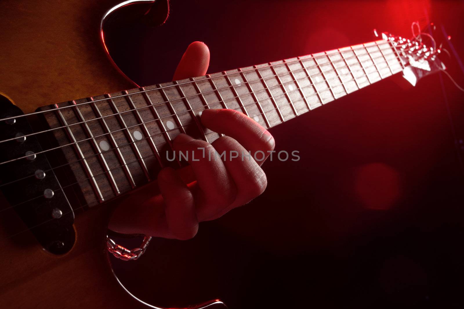 guitar player in action on stage