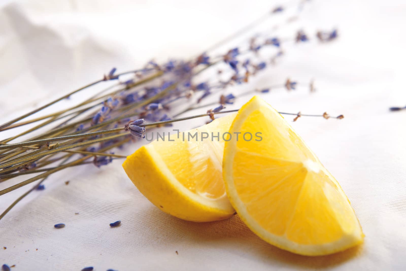 Fresh lemon with lavender on tablecloth