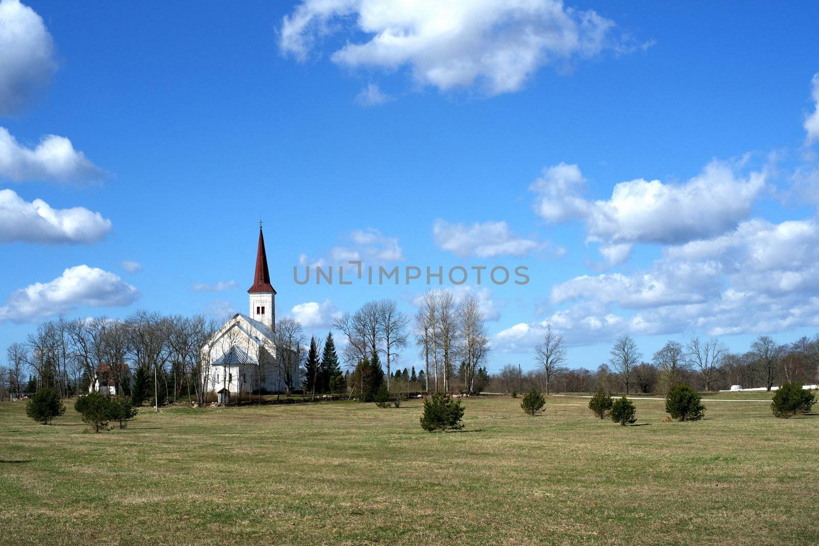 Estonia. Beautiful operating church on a background of the sky and clouds