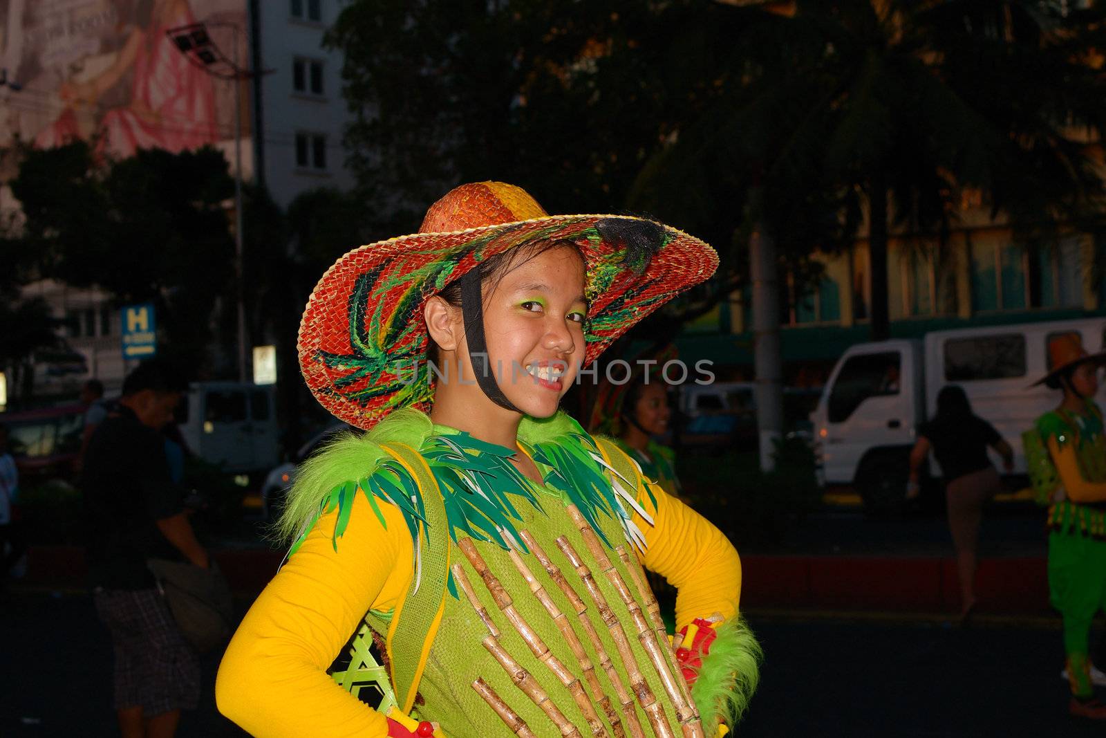 MANILA, PHILIPPINES - APR. 14: girl participant in her cultural dress pauses during Aliwan Fiesta, which is the biggest annual national festival competition on April 14, 2012 in Manila Philippines.