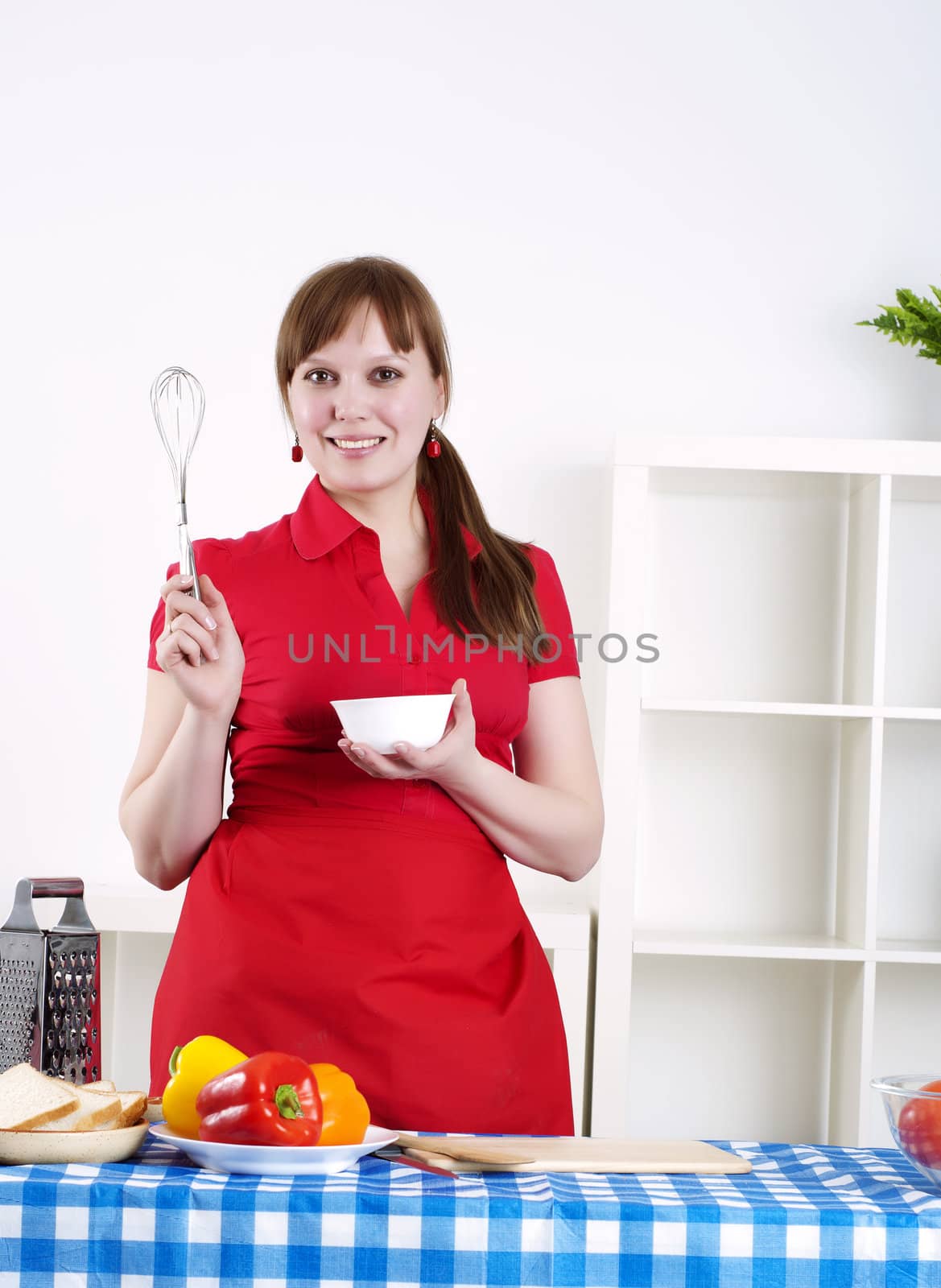 beautiful young woman cooking, the work in the kitchen