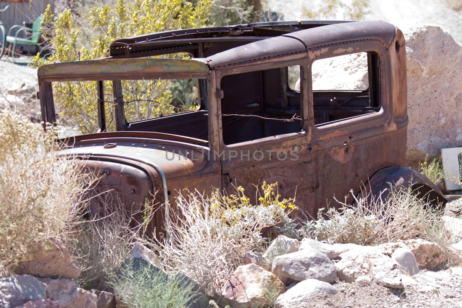old junk car in the nevada desert in Nelson, Eldorado Canyon by GunterNezhoda