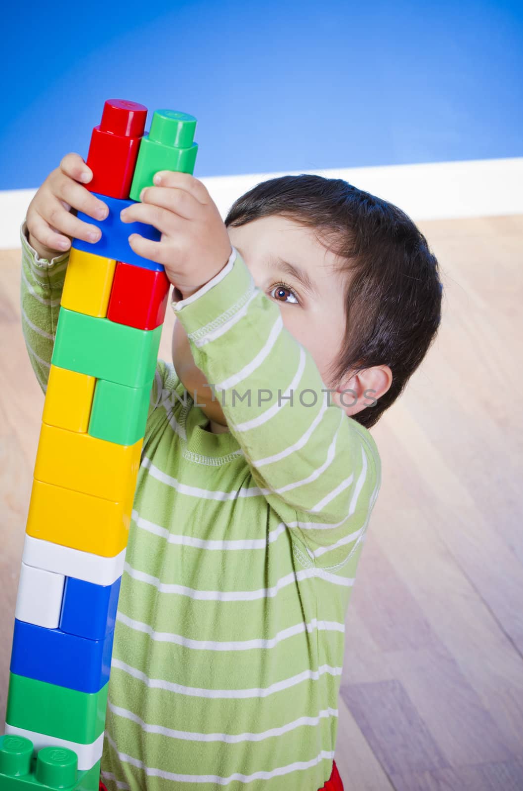Education, cute little boy playing with blocks