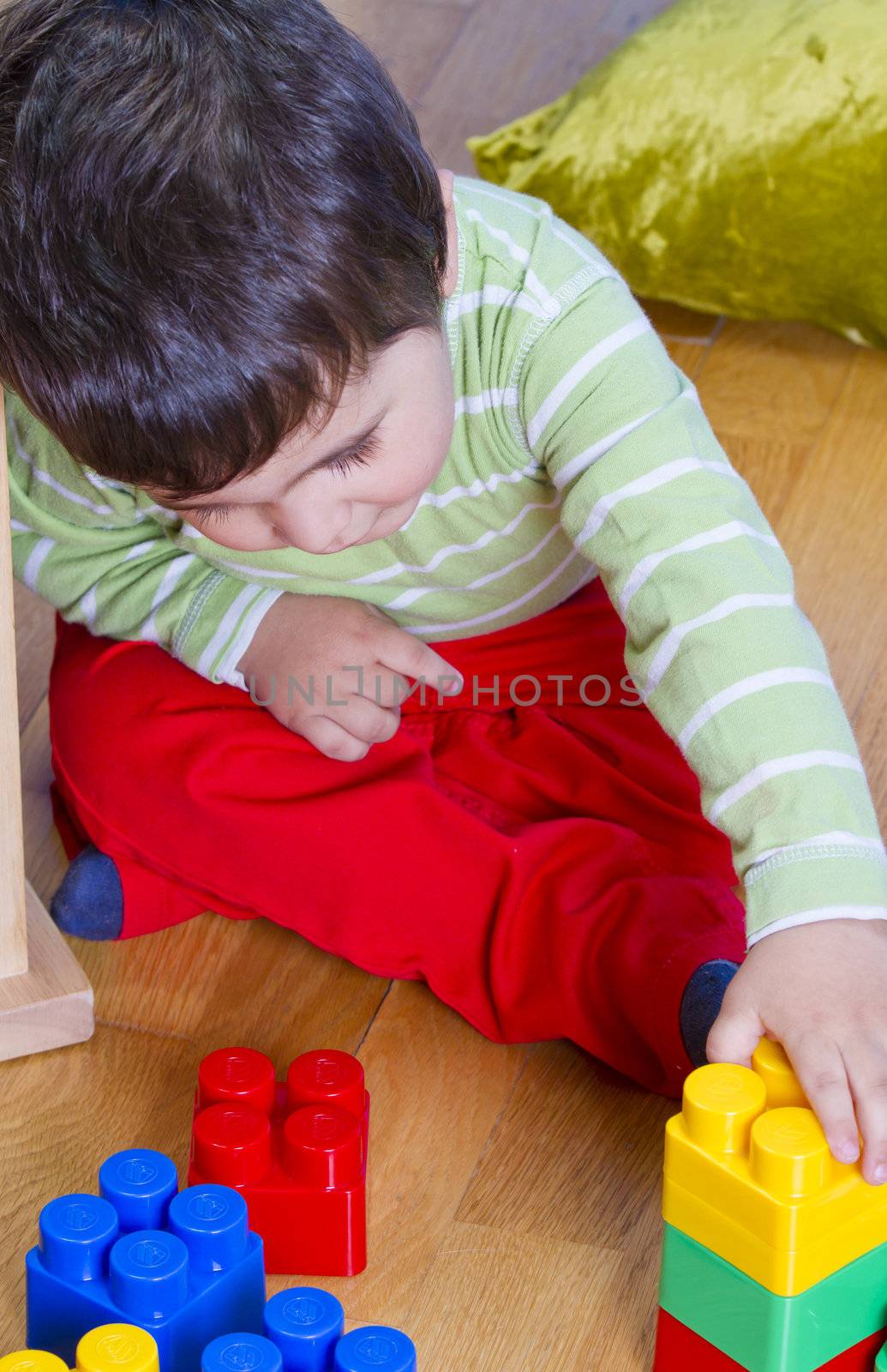Little baby boy (2 years old) playing with toy blocks. Funny edu by FernandoCortes