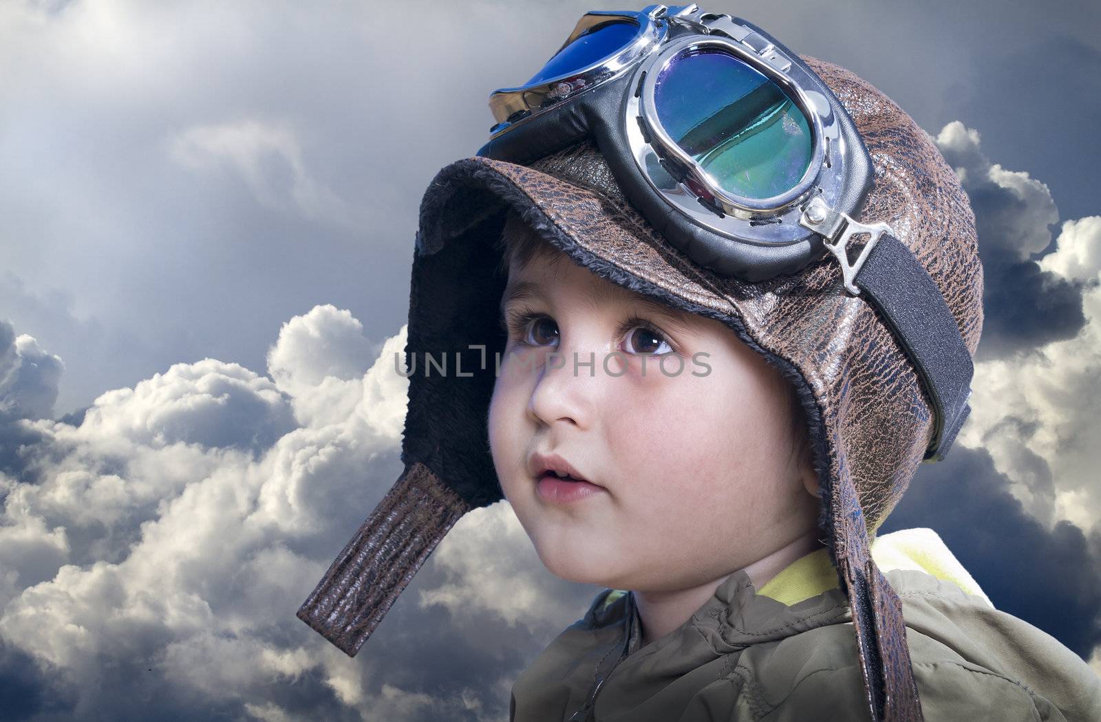 A little cute baby dreams of becoming a pilot. Pilot outfit, hat and glasses