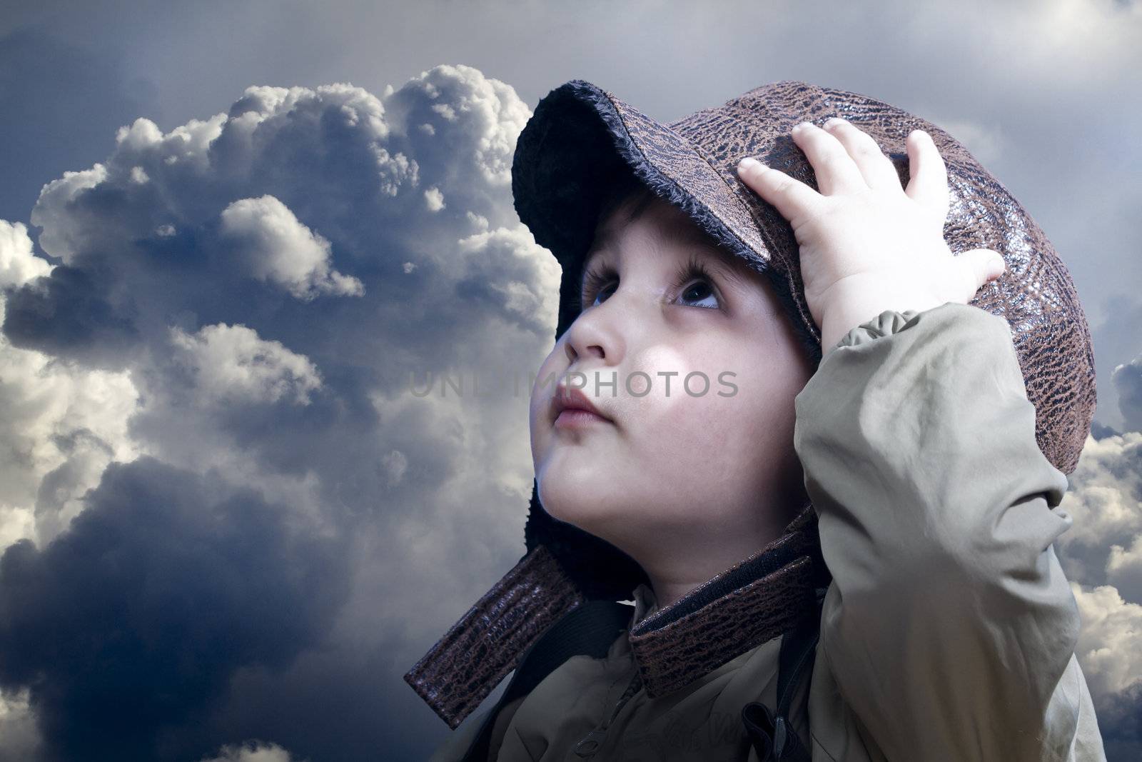 A little baby boy dreams of becoming a pilot. Vintage aviation hat.