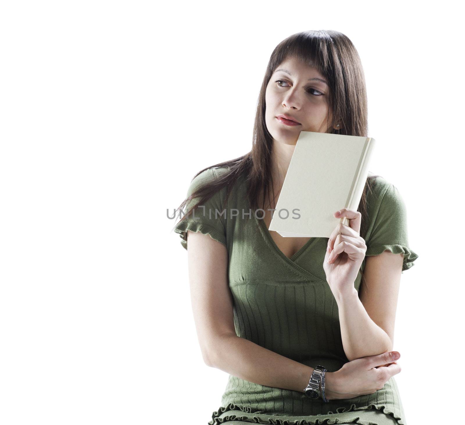 Thinking woman holding a book, cover is blank by stokkete