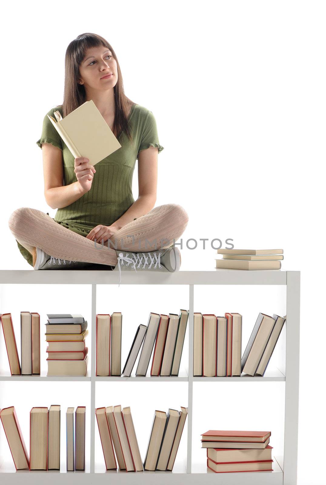 Thinking woman holding a book, cover is blank by stokkete