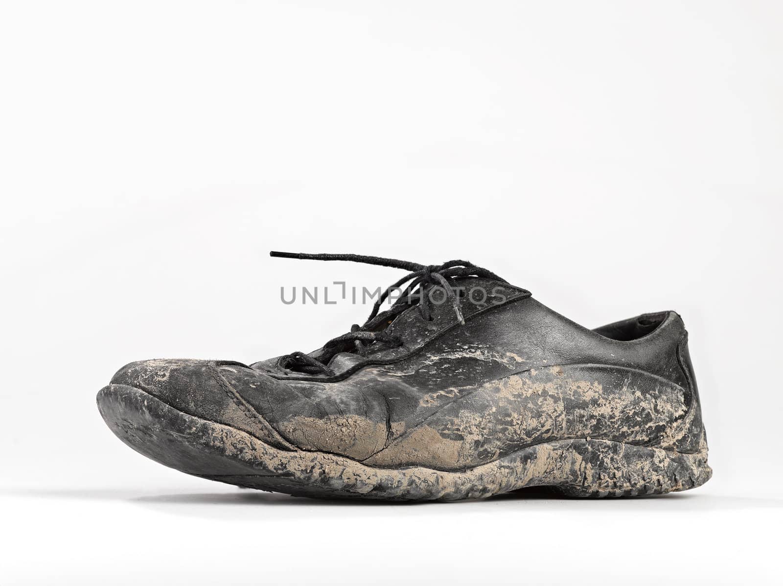 Muddy and dirty shoe by pbombaert