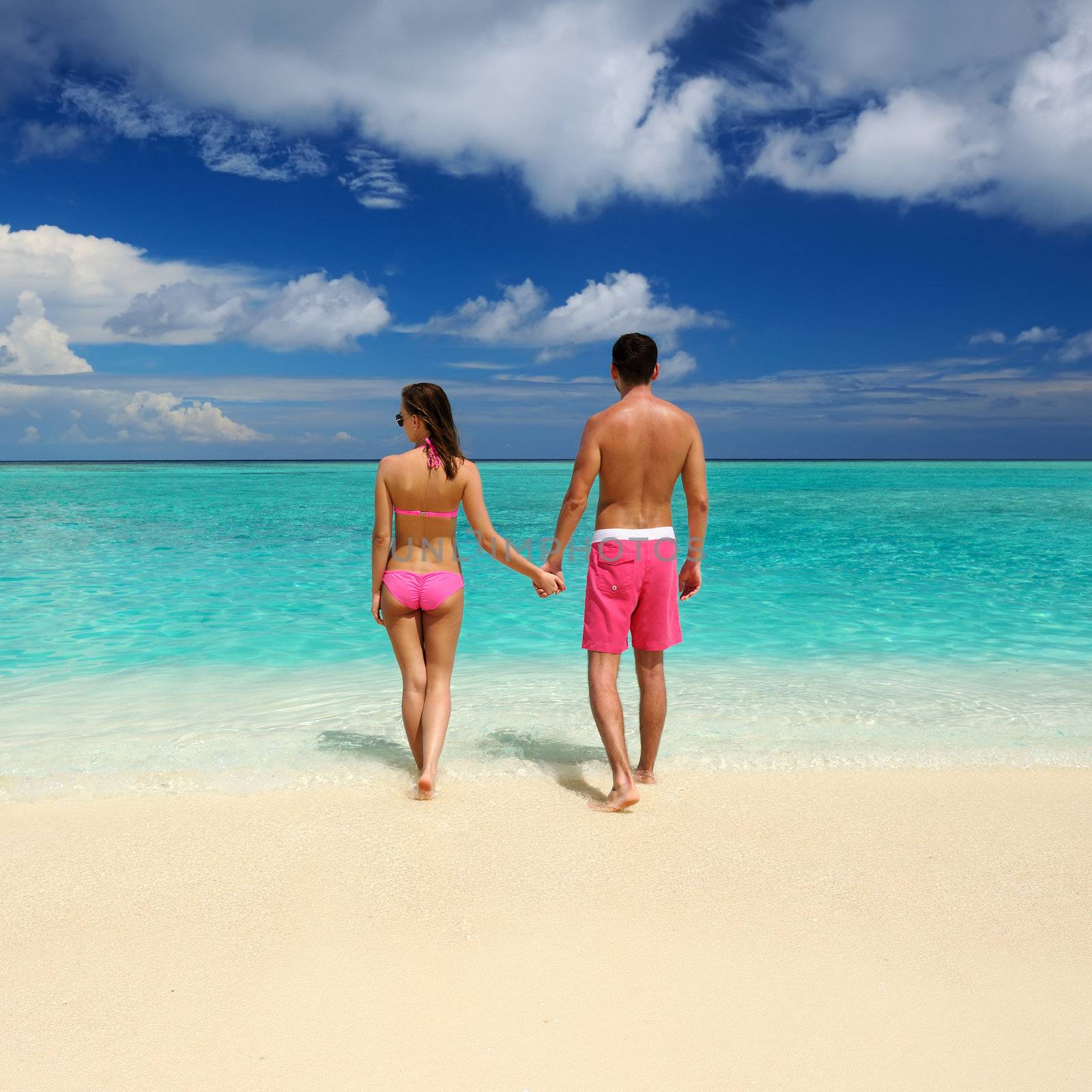 Couple on a tropical beach at Maldives