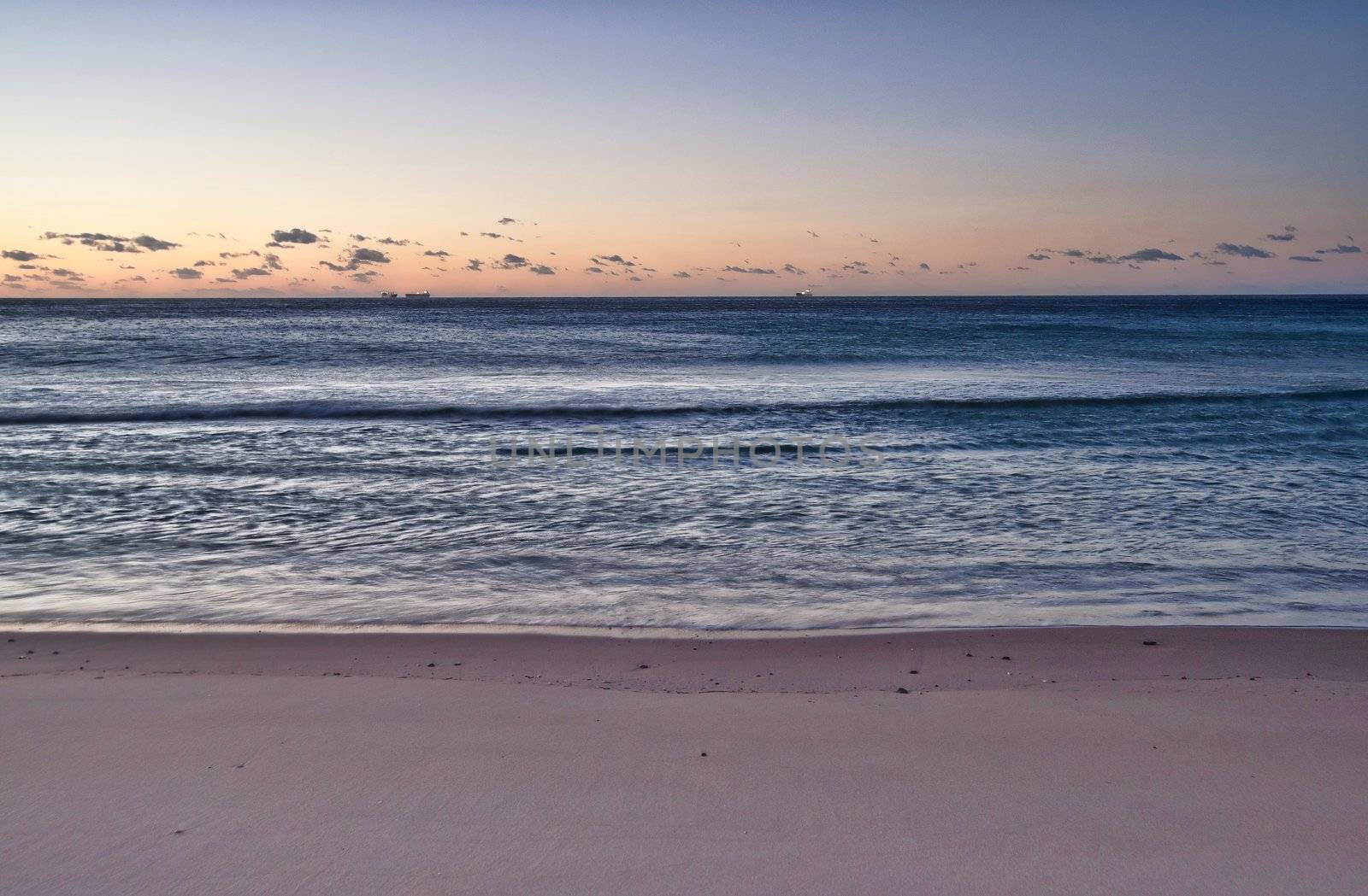 the peaceful beach at wollongong at sunrise