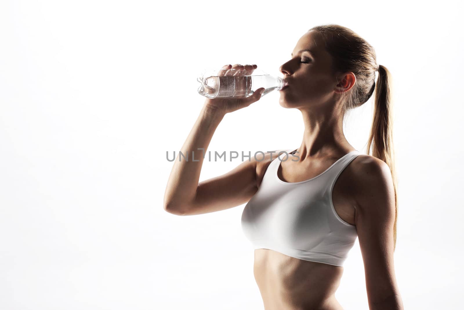 young woman drinking water, on white background