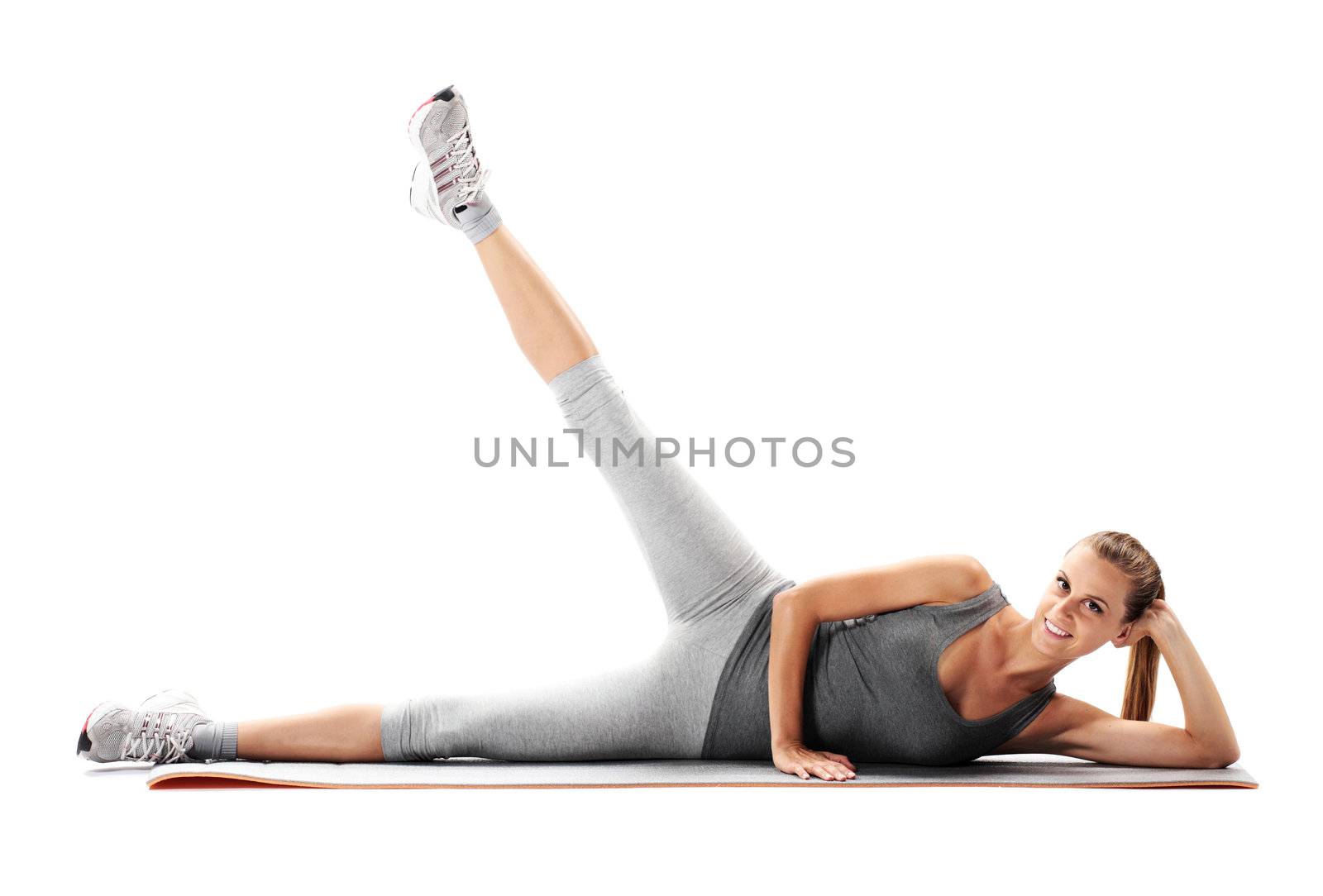 Portrait of a young healthy woman fitness exercises